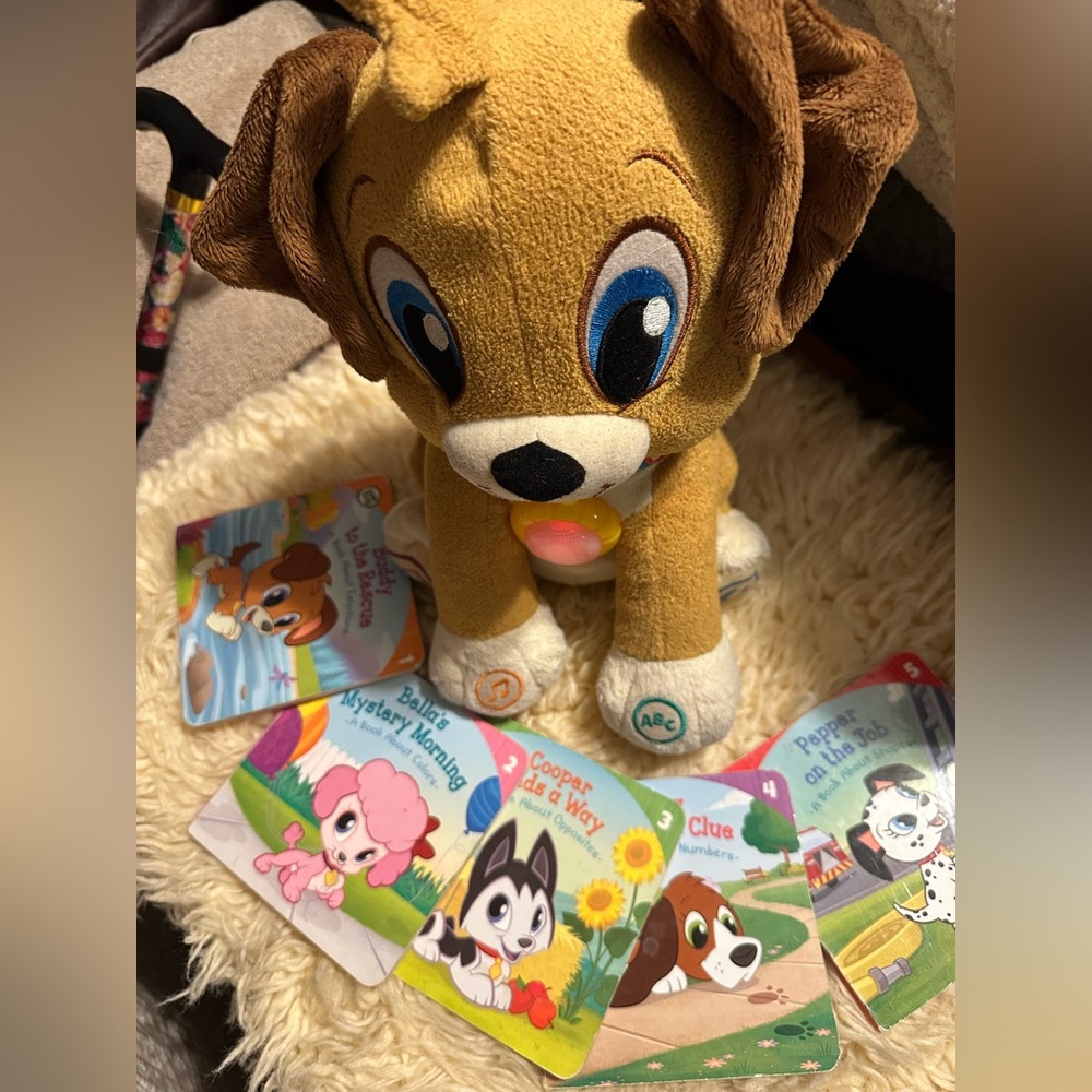 Buddy Plush Dog Toy with books.